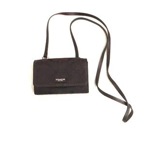 Black small Coach crossover.